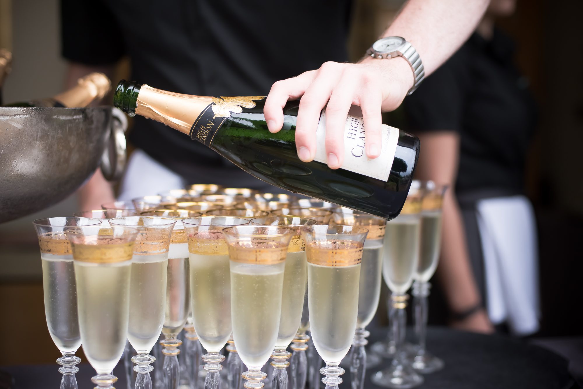 Champagne poured at a High Clandon wedding