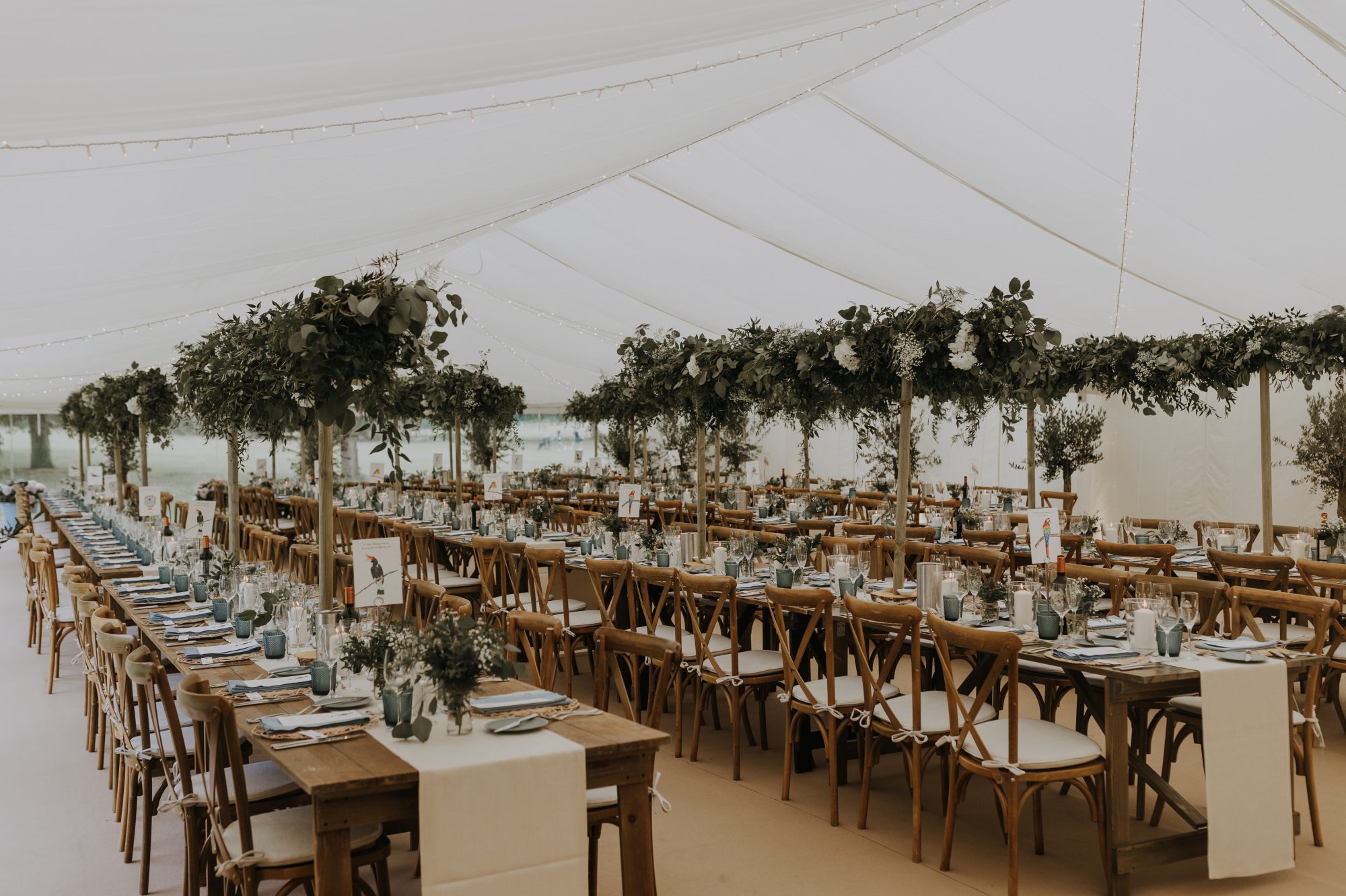A marquee dressed for a summer wedding